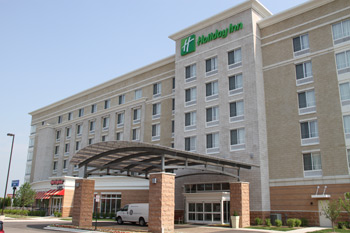 Holiday Inn Detroit Metro hotel exterior near DTW airport offering park and stay packages with secure Detroit airport parking.
